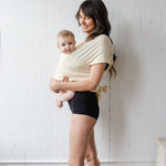 Momme | sustainable kangaroo wrap with baby in milk