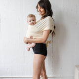 Momme | sustainable kangaroo wrap with baby in milk
