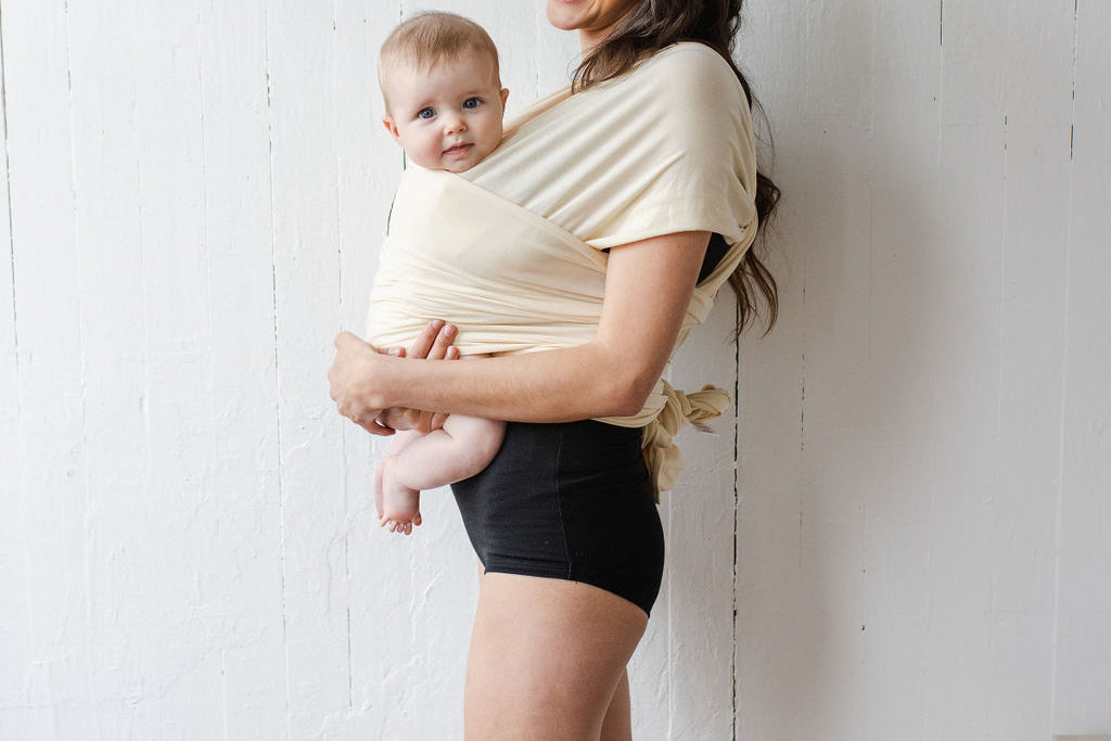 Momme | sustainable kangaroo wrap with baby in milk