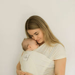 Momme | sustainable kangaroo wrap with baby in milk