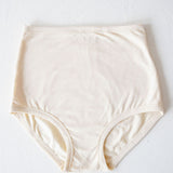 High-waisted pregnancy and postpartum underwear in the color milk by Momme